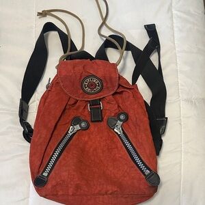 Kipling Rust-Red Canvas Drawstring Mini Backpack